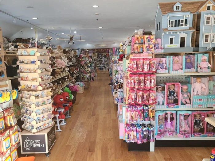 Dollhouses and dolls aisle inside Kids Cargo toy store