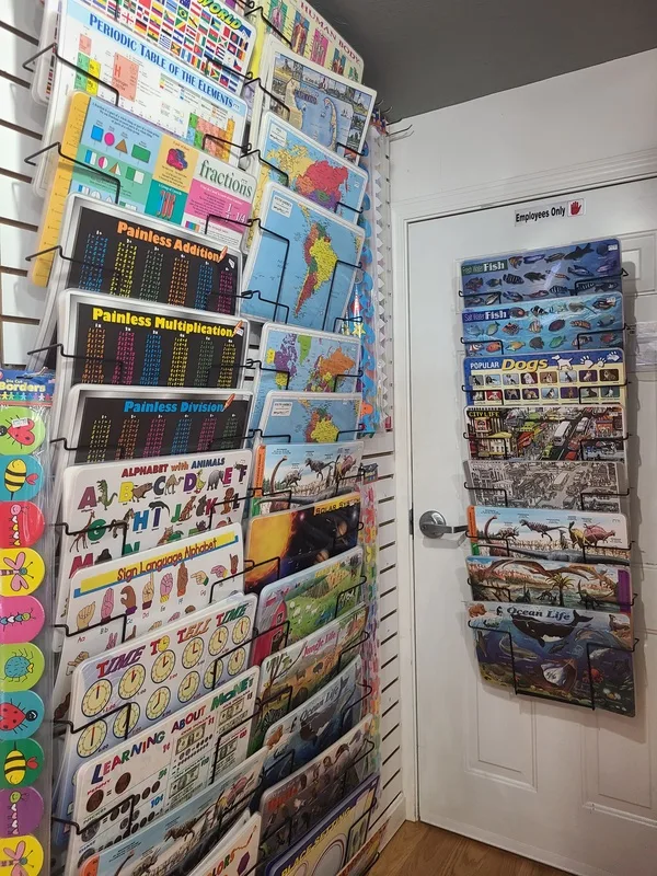Children's books and activity books wall at Kids Cargo