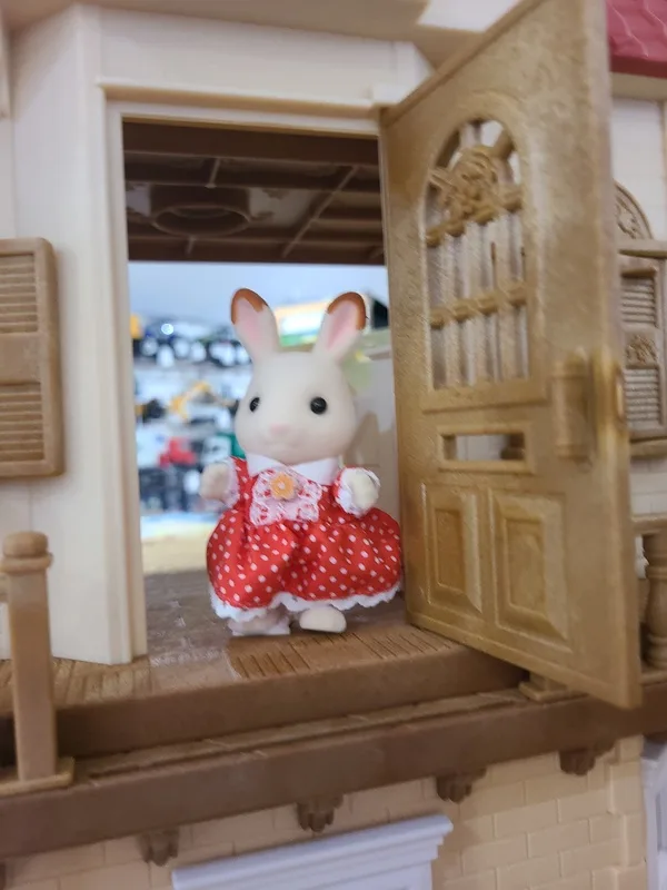 Calico Critters character families and dollhouse furniture