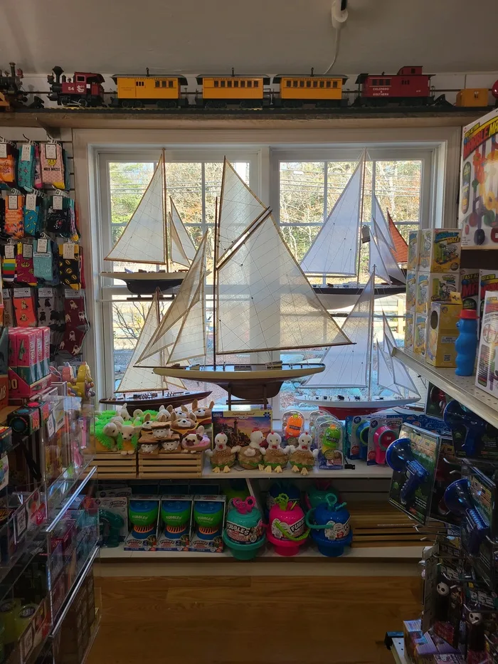 Model sailboats displayed in the front window
